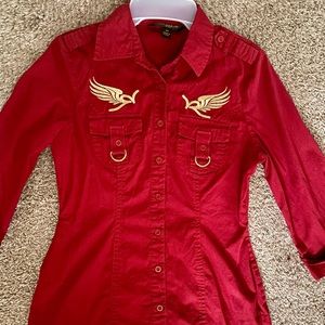 This is an authentic vintage Rocawear brand button up red shirt with gold logos!